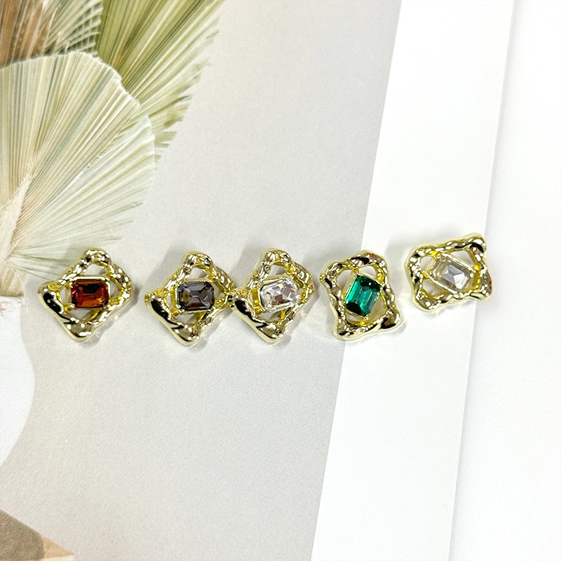 Gold-tone rhinestone buttons with red, clear, and green gems in decorative bezels