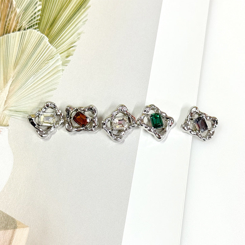 Rhinestone gem buttons with clear, green, amber, and red crystals in metal bezels