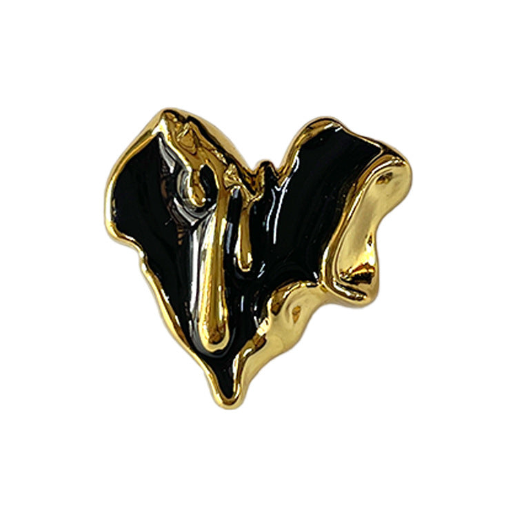 Single black heart metal coat button with shank and glossy gold lava-style finish, 23mm