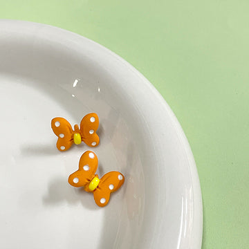 Orange cartoon bow metal shank button, 15x12mm, yellow center, 2 front views