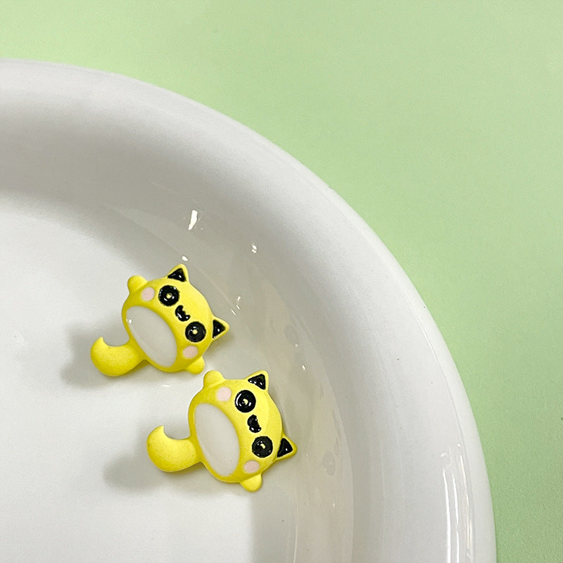 Yellow cartoon Totoro metal buttons, 16x18mm, two shown.