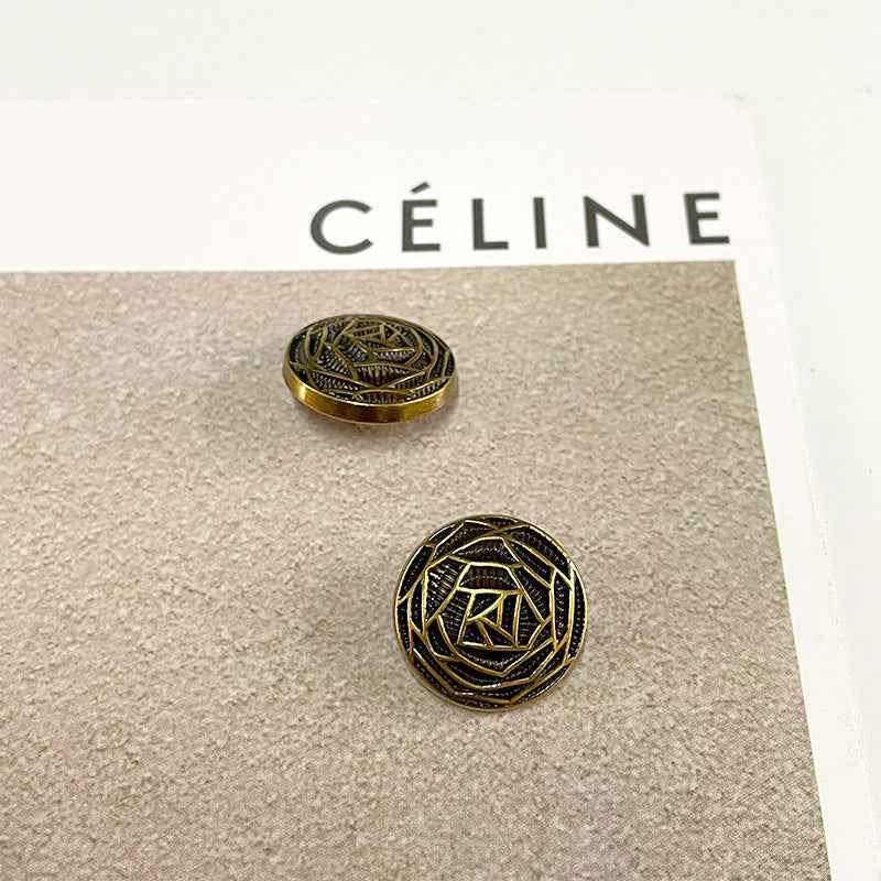 Bronze woven floral metal button with geometric flower-core pattern and gold trim