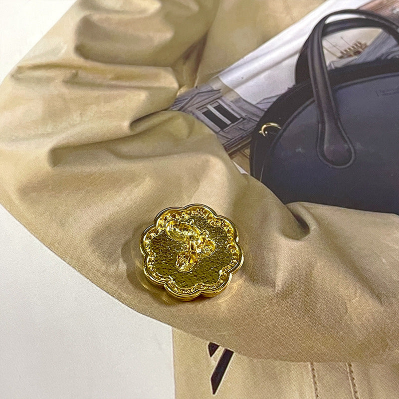 Gold-tone bunny metal button with pearl details and sparkling rhinestone edge