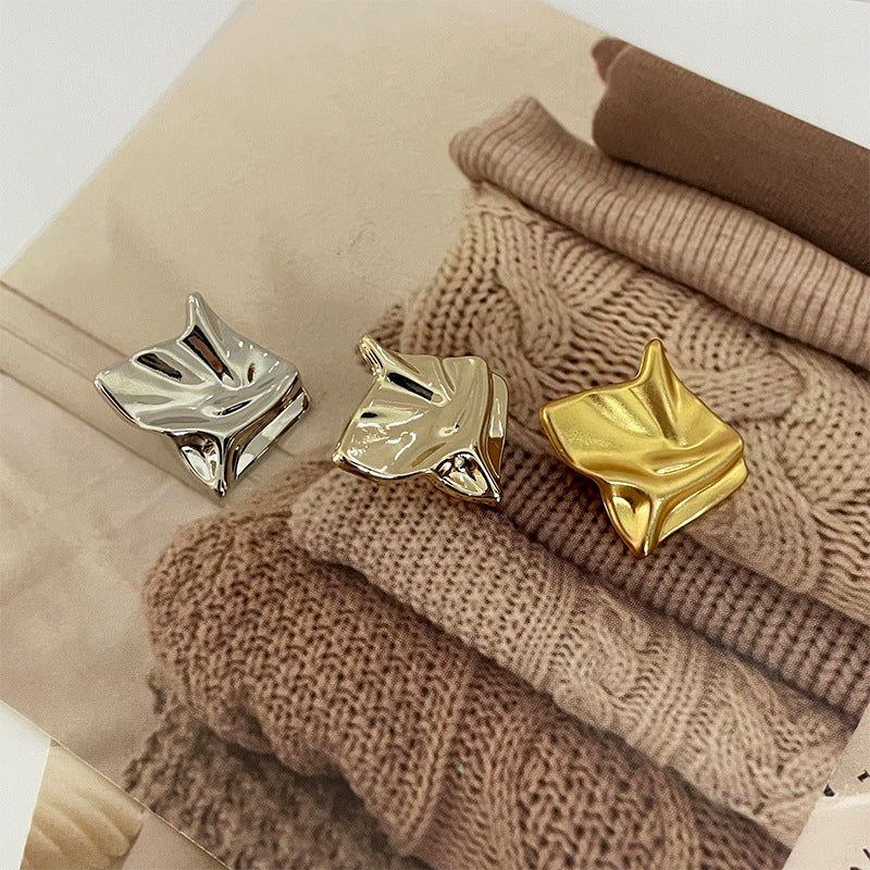 Silver and gold irregular wave-grid metal buttons, textured woven square shapes