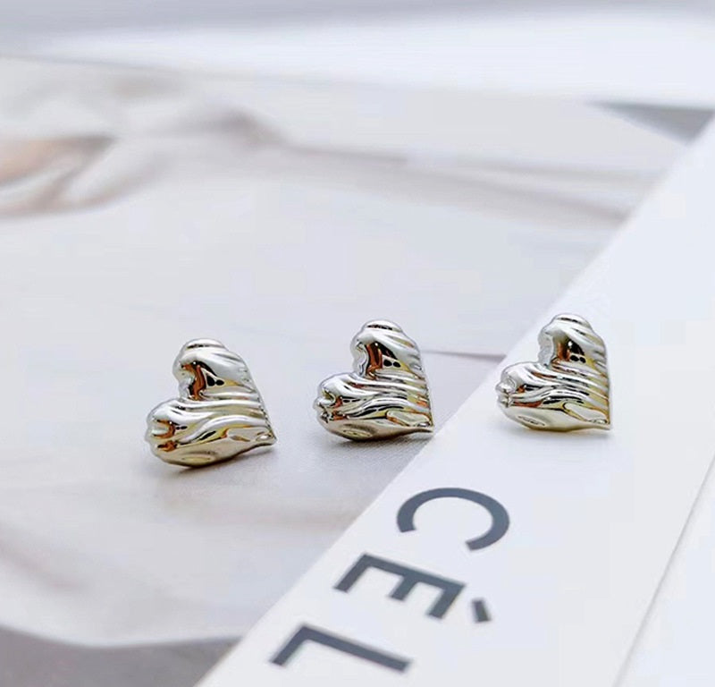 Three silver heart-shaped metal buttons with vintage swirl texture, 12mm