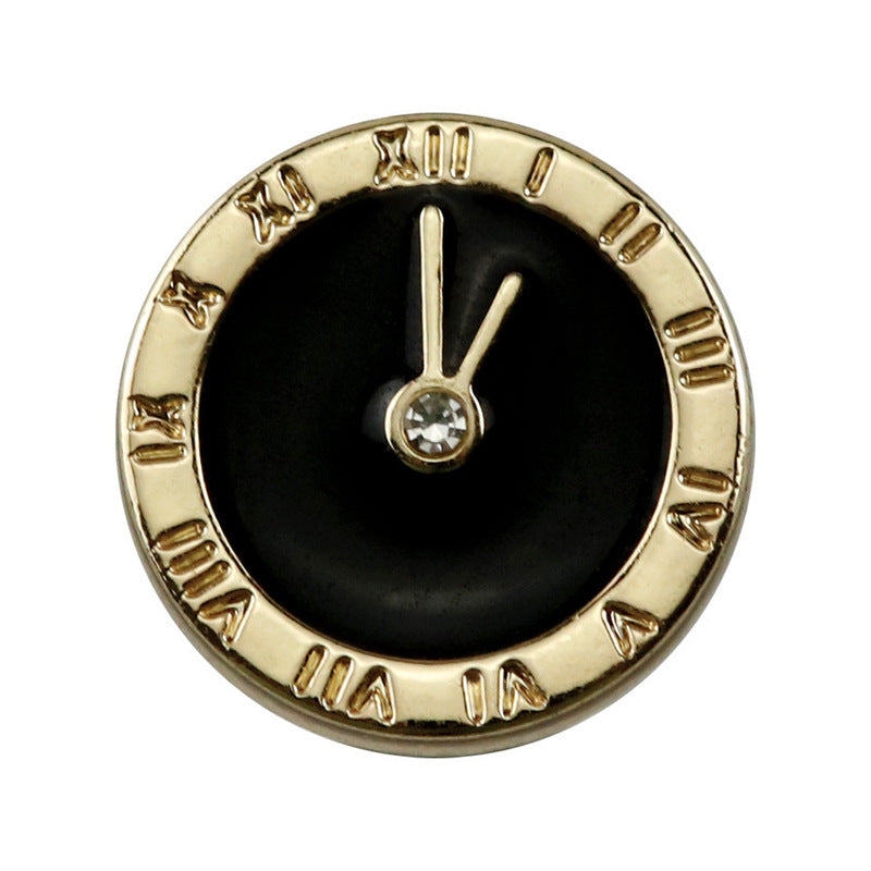 Single round clock-style button with black enamel face, gold-tone rim, central gem