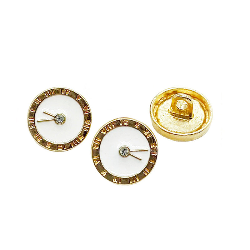 White and black enamel clock buttons with gold-tone rims plus visible button backs
