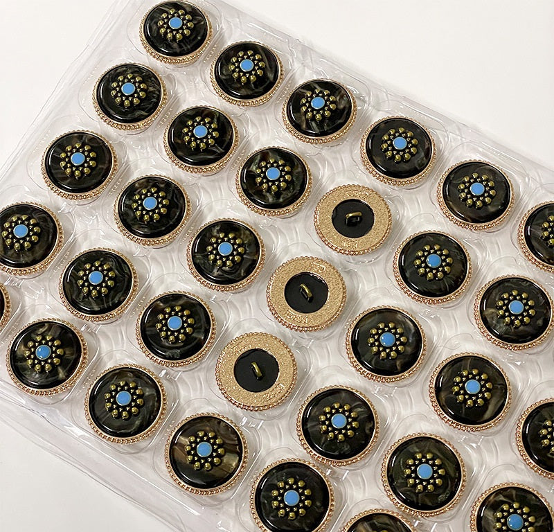 Tray of round vintage plum blossom metal shank buttons, black and white faces, blue flower centers