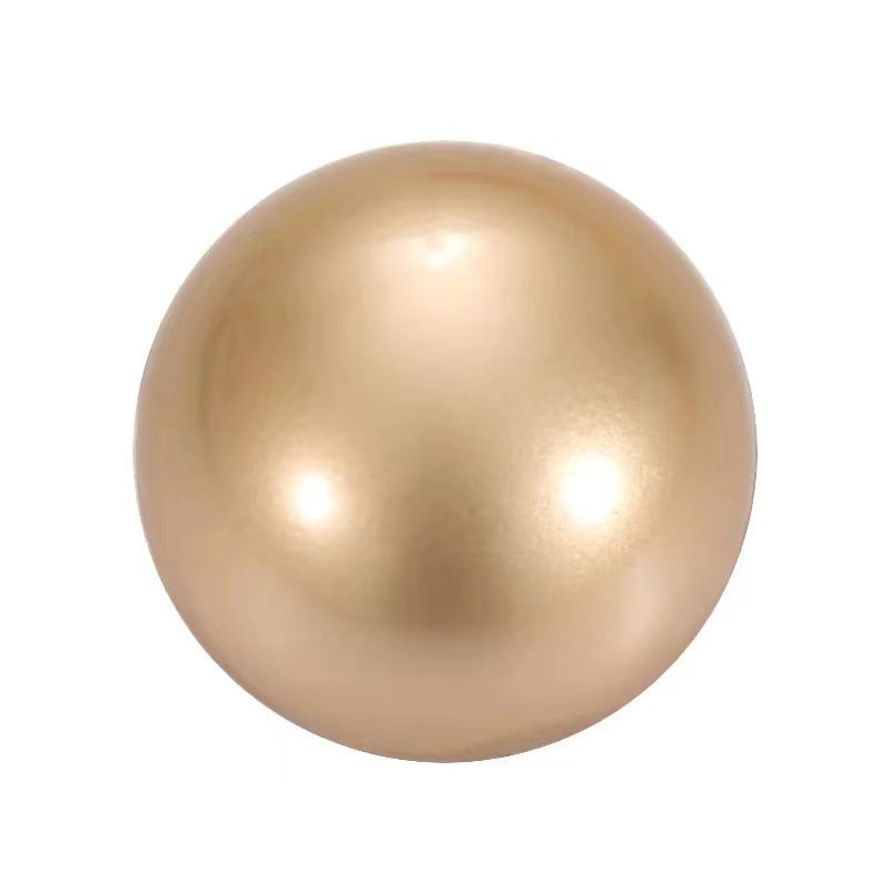 Shiny gold mushroom button with smooth glossy finish