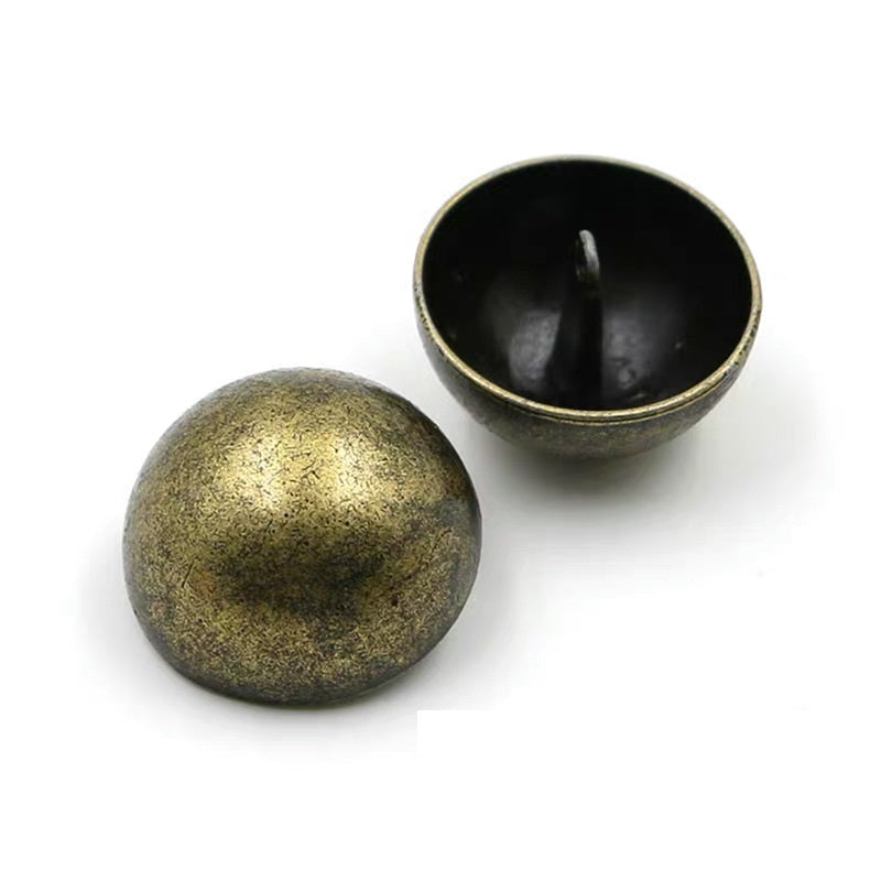Bronze mushroom metal buttons with subtle textured sheen, front and back