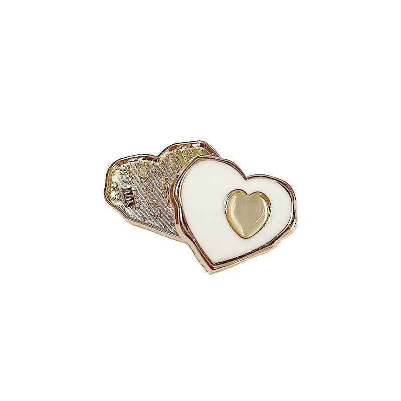 White heart sewing button with gold-tone back and raised heart center