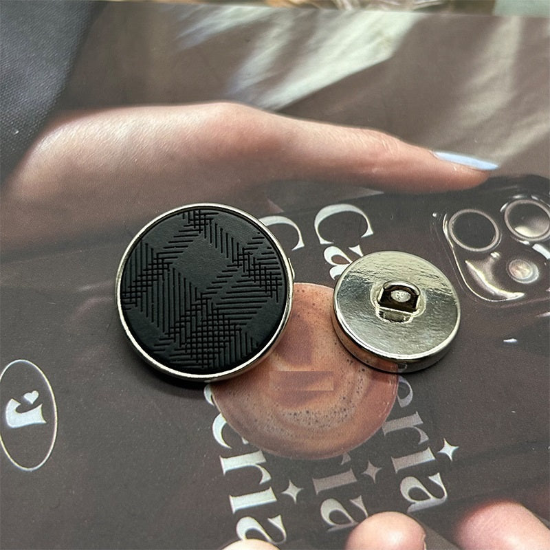 Gun black resin twill metal button with shank, engraved face and back plate visible