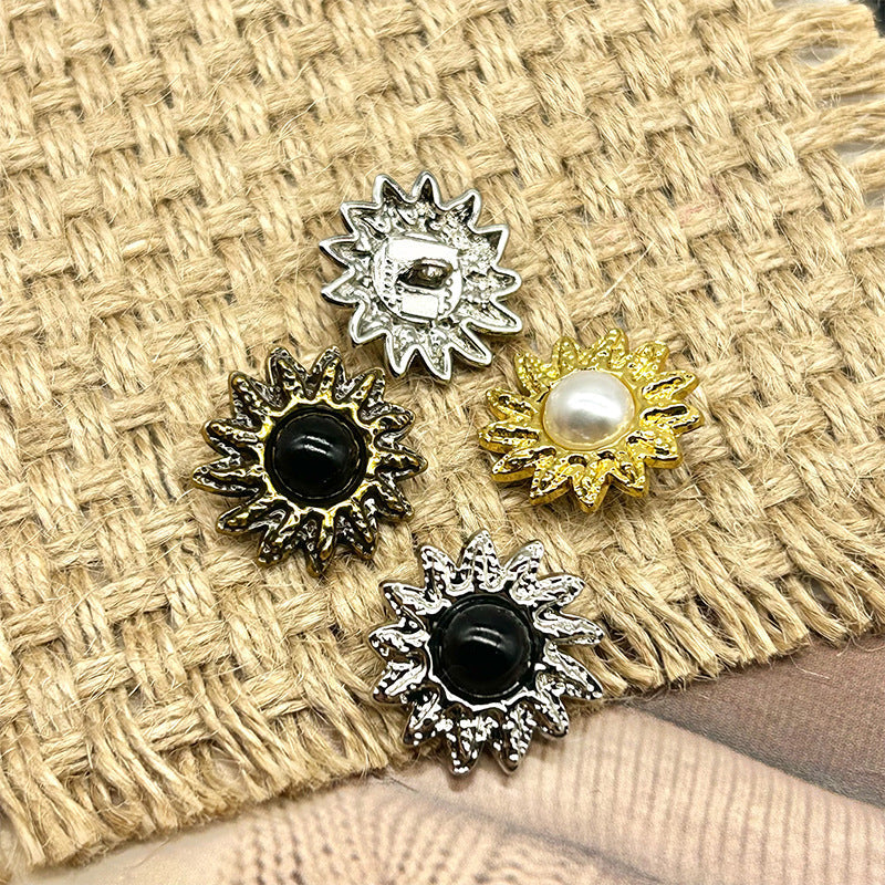 Sunflower-shaped pearl metal buttons in silver, black, and gold finishes with raised petals