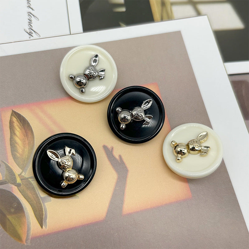 Dual-tone rabbit round buttons: cream with silver-tone rabbit and black with silver-tone.