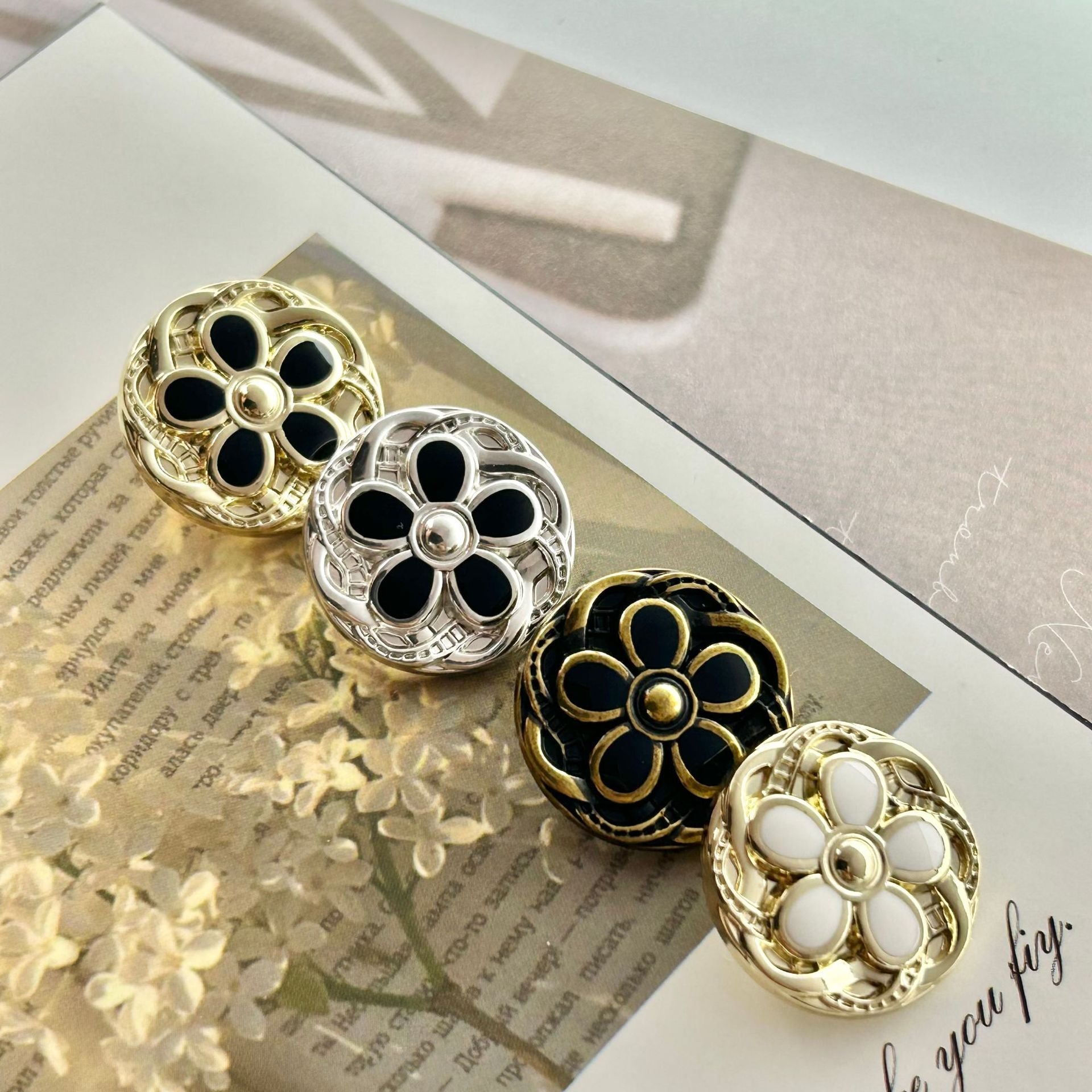 Vintage metal button, round floral lace design, gold-tone with black enamel