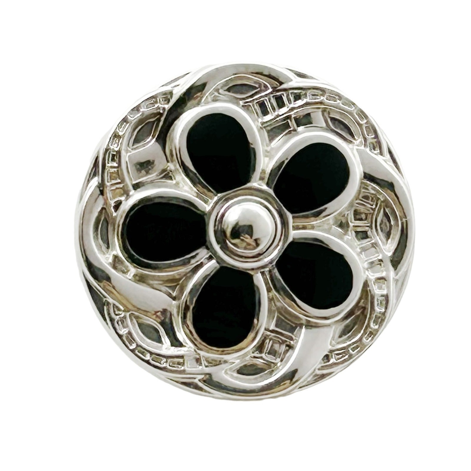 Round metal button, silver-tone floral lace design with black enamel petals