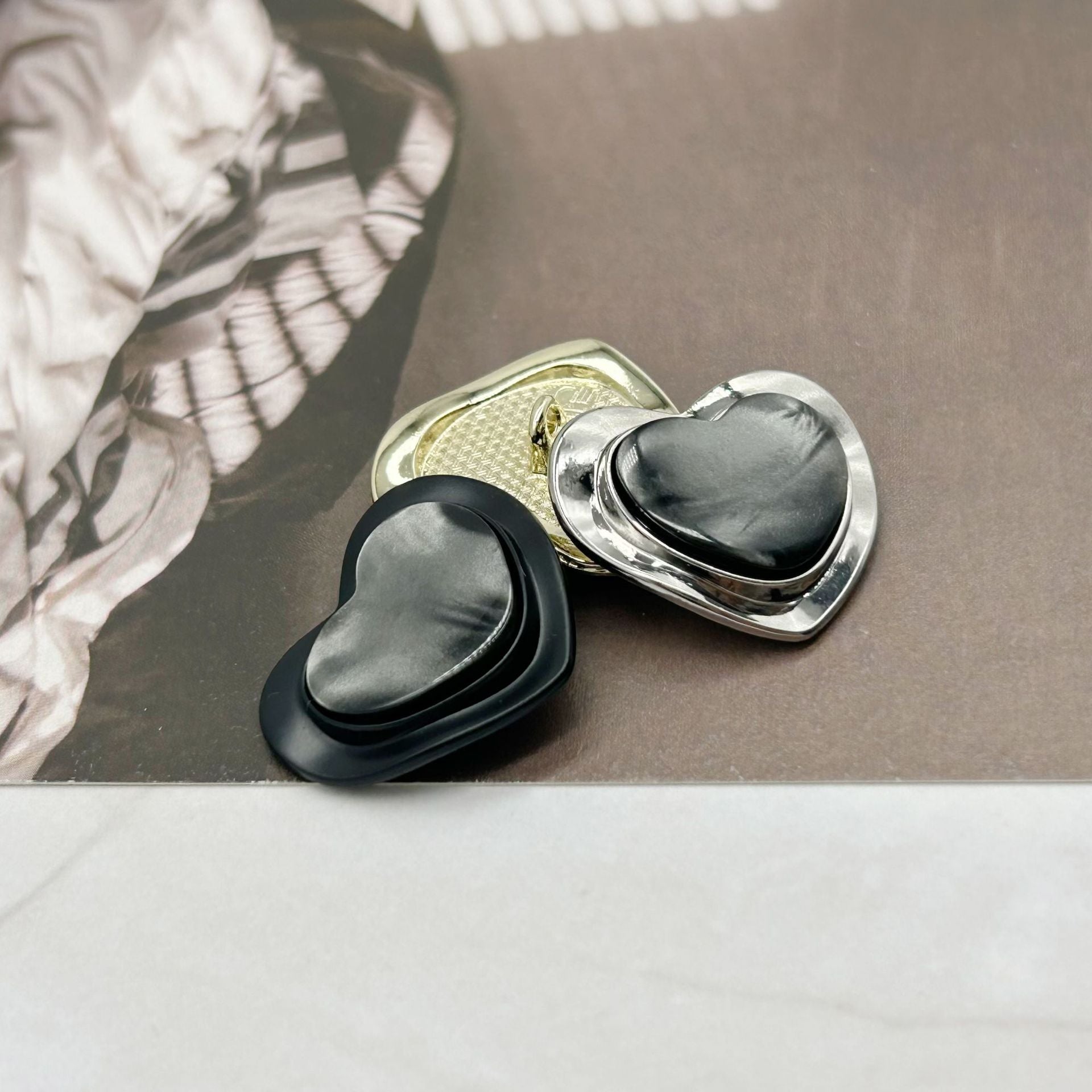 Silver-toned heart-shaped resin alloy buttons with dark charcoal resin, pearlized