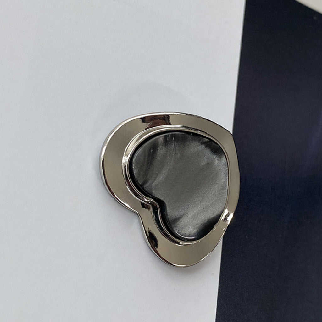 Silver heart-shaped resin alloy button with dark resin insert, pearlized look