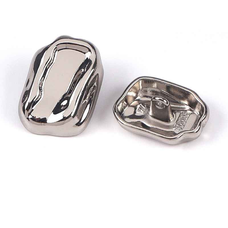 Silver irregular metal shank button, front and back
