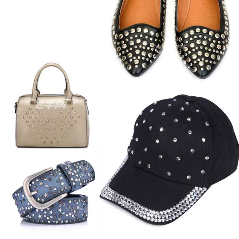 Round 4-prong rivets embellishing a black cap and black shoes