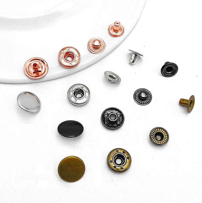 Mixed snap button pieces in black, silver, gunmetal, and bronze with snap posts