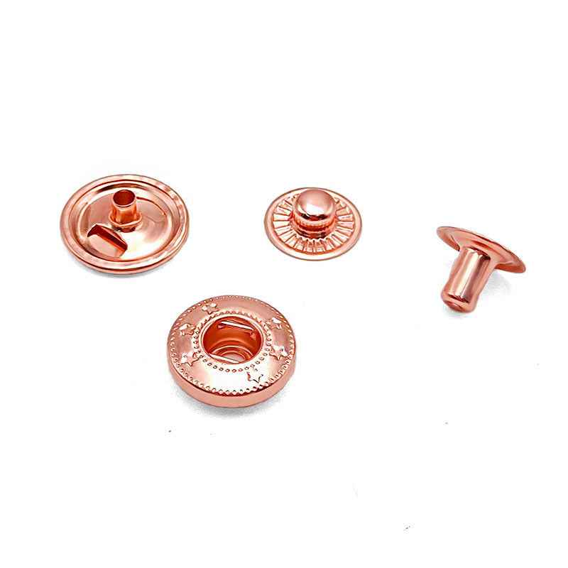 Rose gold snap button components: round caps with central eyelet and posts