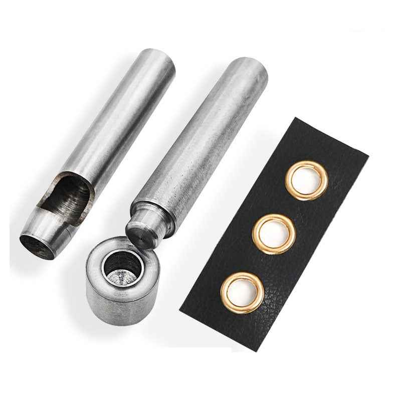 Grommet eyelet punch dies with metal setters and brass-tone rings on backing card