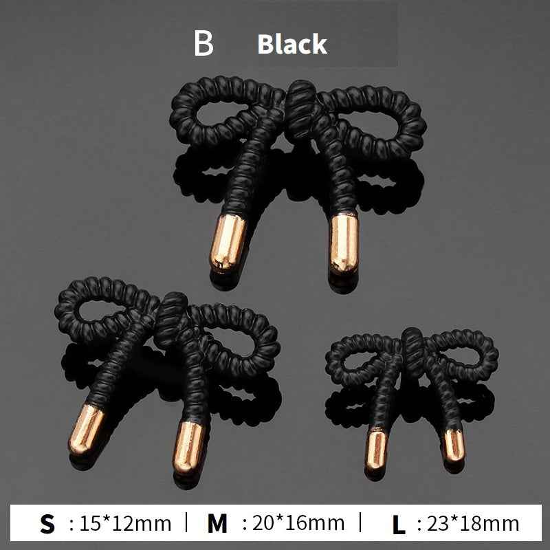 Style B stick buttons: black ribbed loops with gold stems, 3 sizes shown