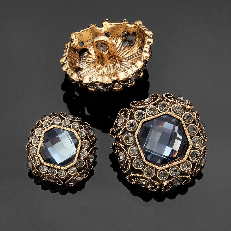 Rhinestone coat shank buttons: light blue-grey faceted centers with gold-tone rhinestone border and backs