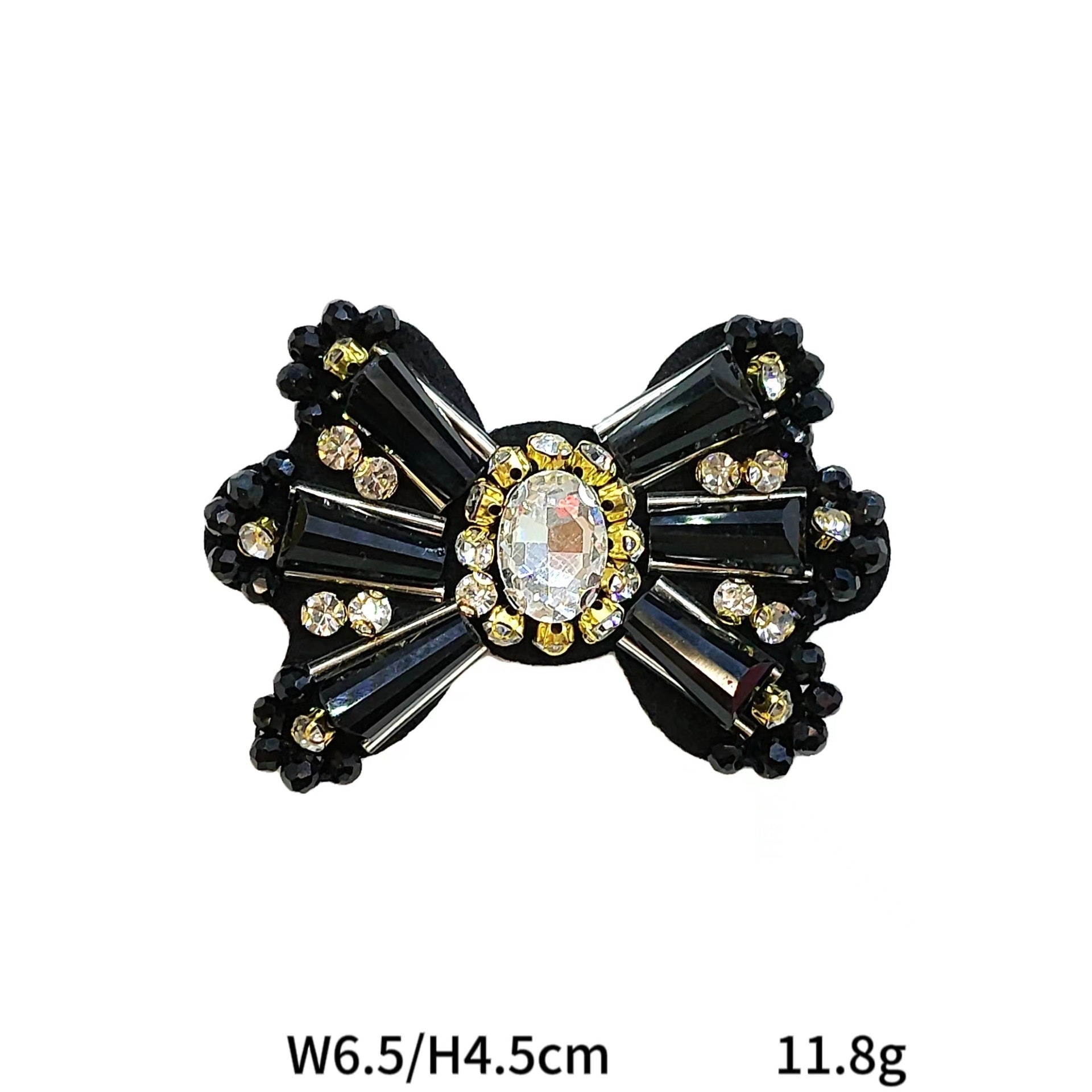 Black rhinestone bowtie fabric patch with oval center and gold-toned accents