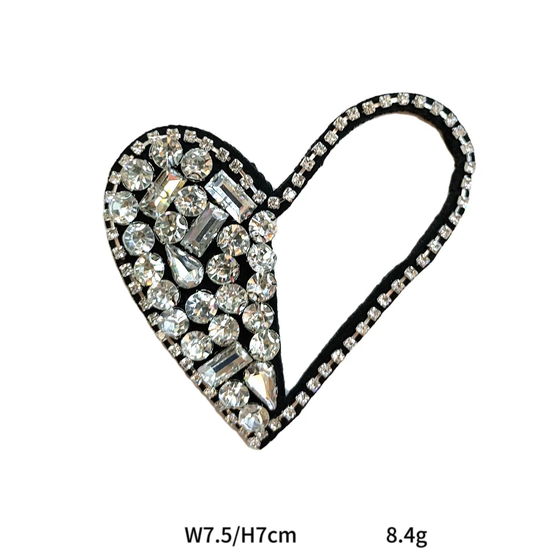 Black-outlined heart fabric patch with clear rhinestones and gold-toned details
