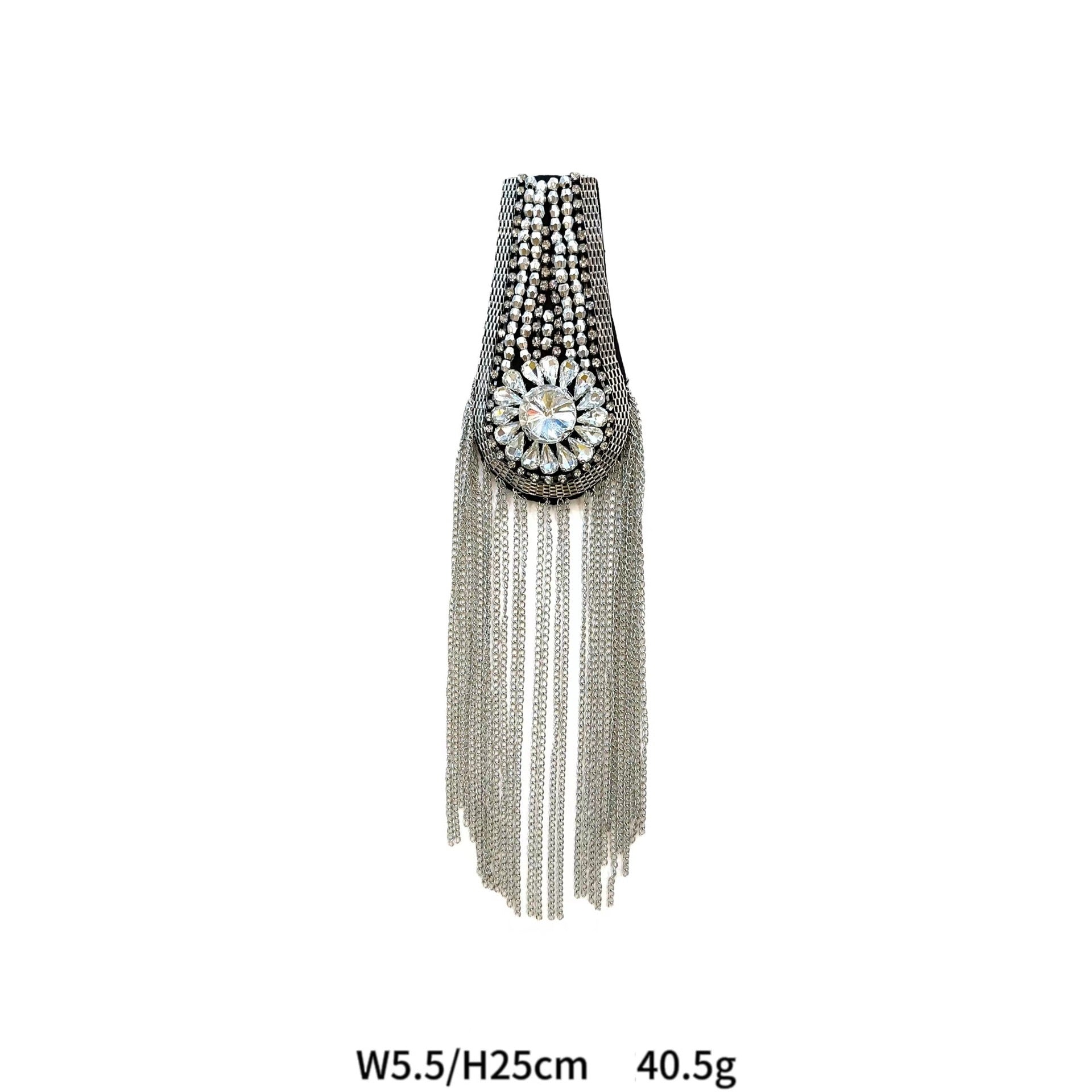 Silver and dark crystal shoulder patch with flower-like center and hanging strands