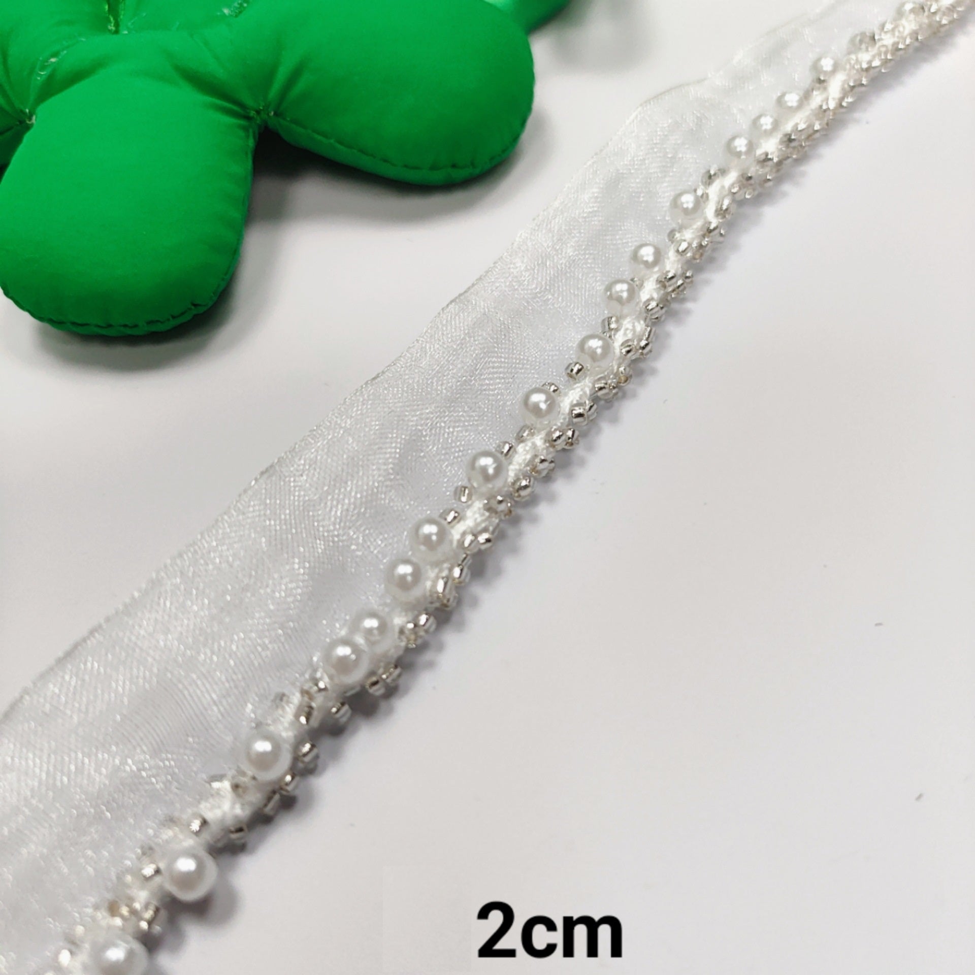 White crystal lace ribbon with pearl trim; 2cm wide