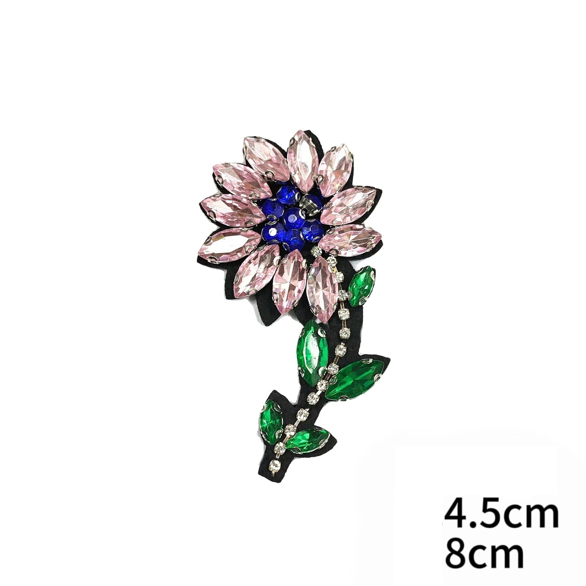 Pink flower and green leaf fabric patch with blue gem center and rhinestones