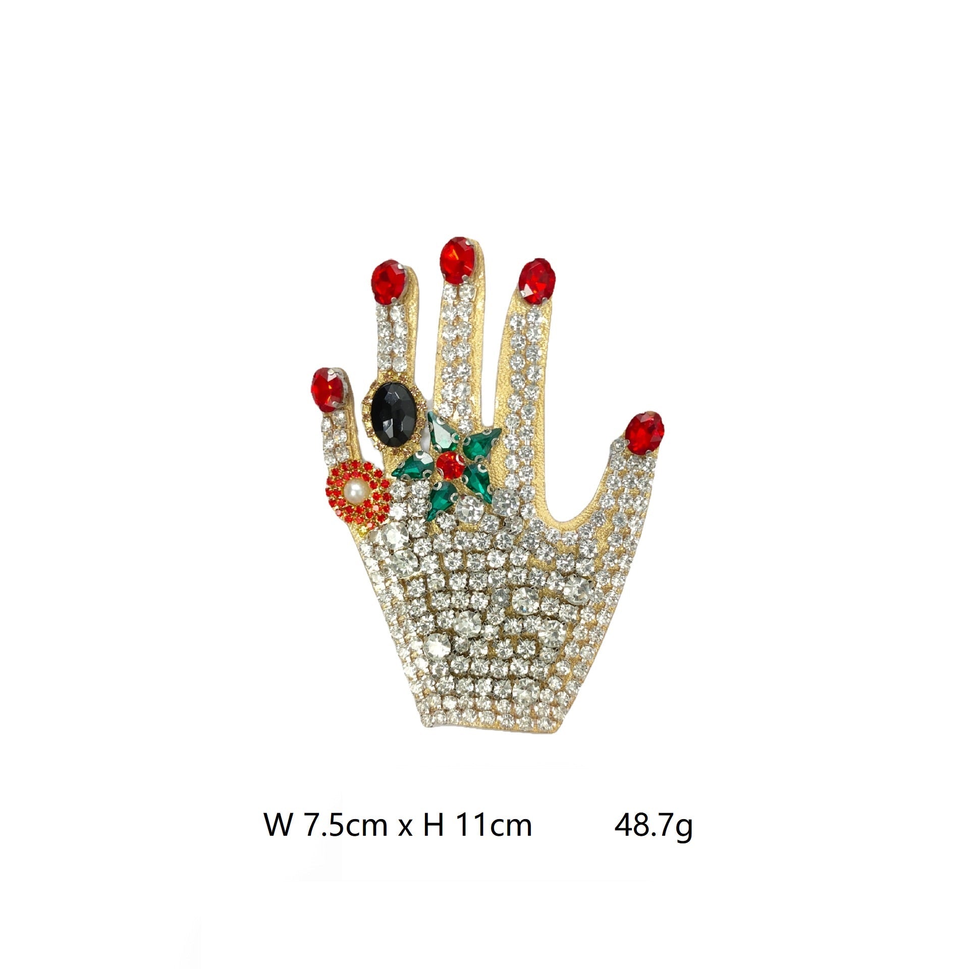 Jeweled hand patch with red gems, pearls, green accents, and black oval center