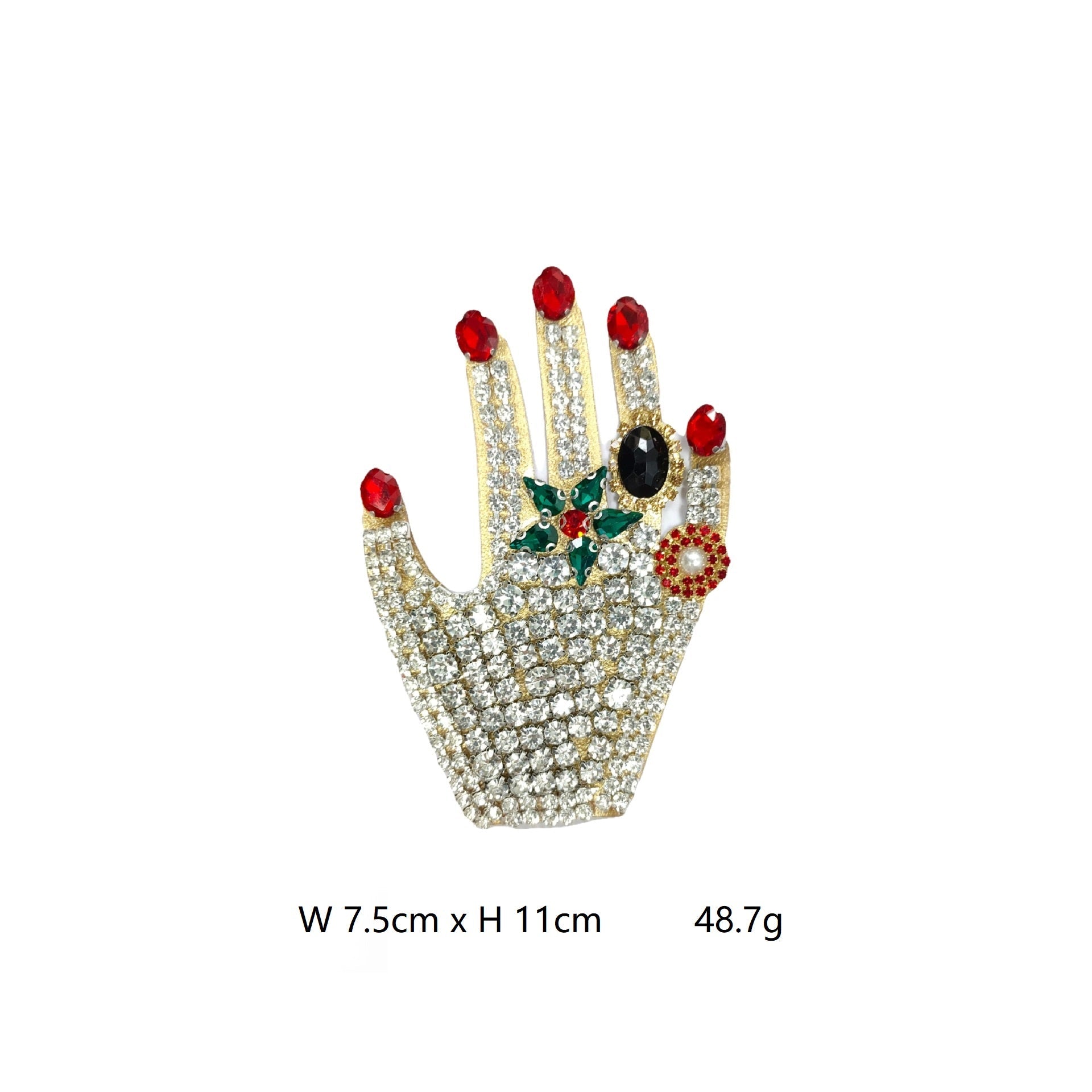 Jeweled hand patch with red stones, pearl detail, green gem center, and clear crystals