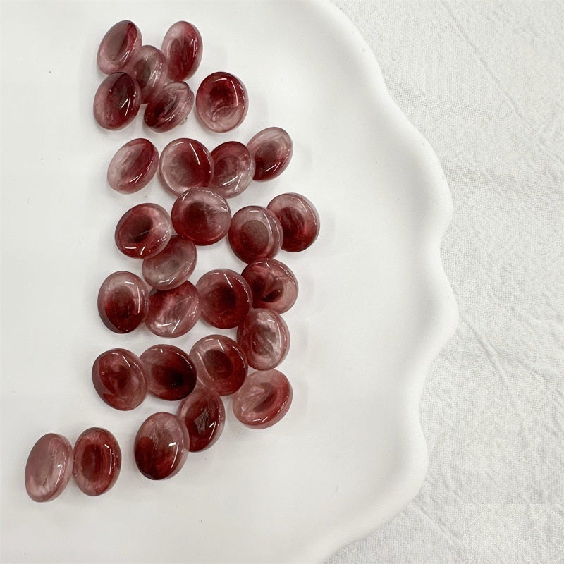 Round resin shank buttons in red and pink tones, 11.5mm