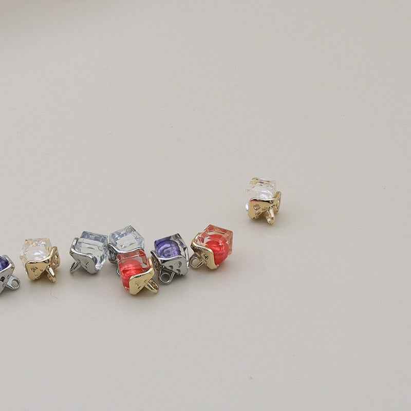 Assorted row of 11mm square alloy resin buttons with metal loops