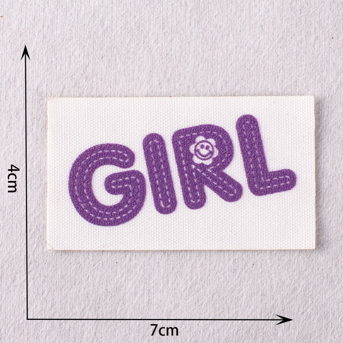 Purple stitched letter patch “GRL” for jacket repairs