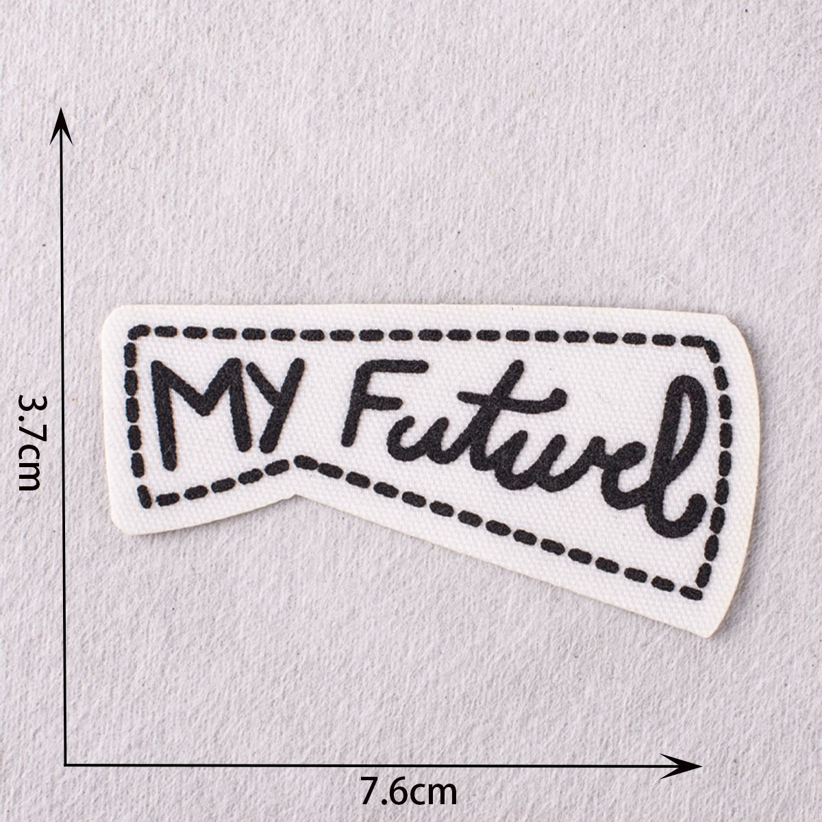 White patch with stitched border reading “My Future” in black script