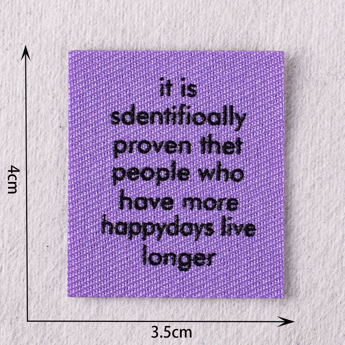 Lilac stitched quote patch with black text “it is scientifically proven…”