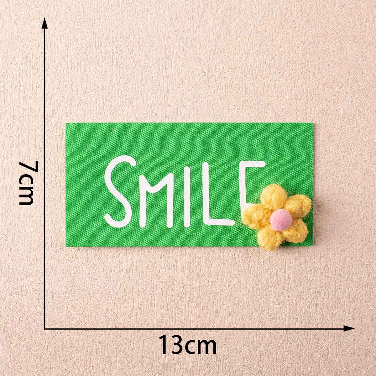 13cm SMILE badge, green fabric with yellow flower embellishment