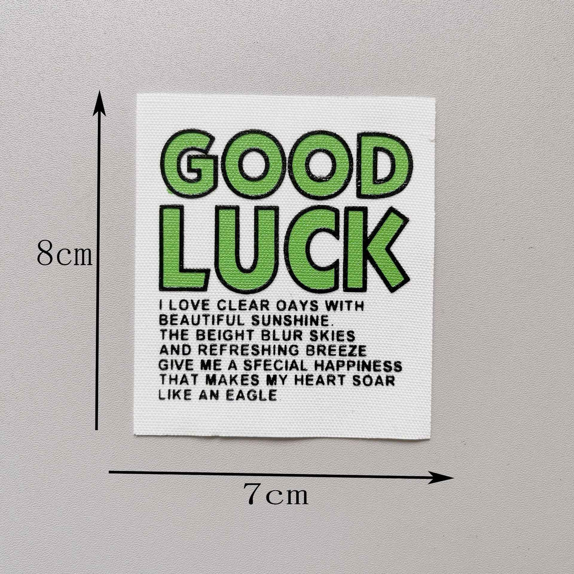 “GOOD LUCK” fabric patch, green letters on white, 8x7cm