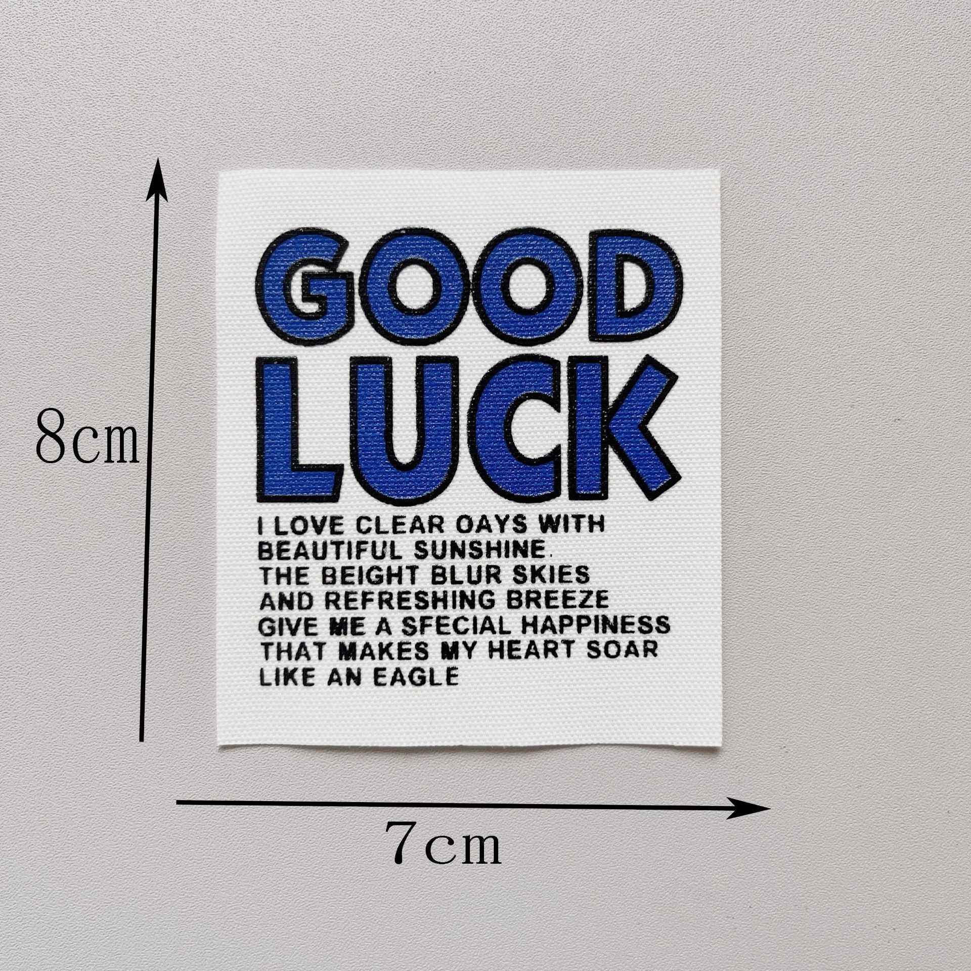 “GOOD LUCK” fabric patch, blue letters with dark outline, 8x7cm