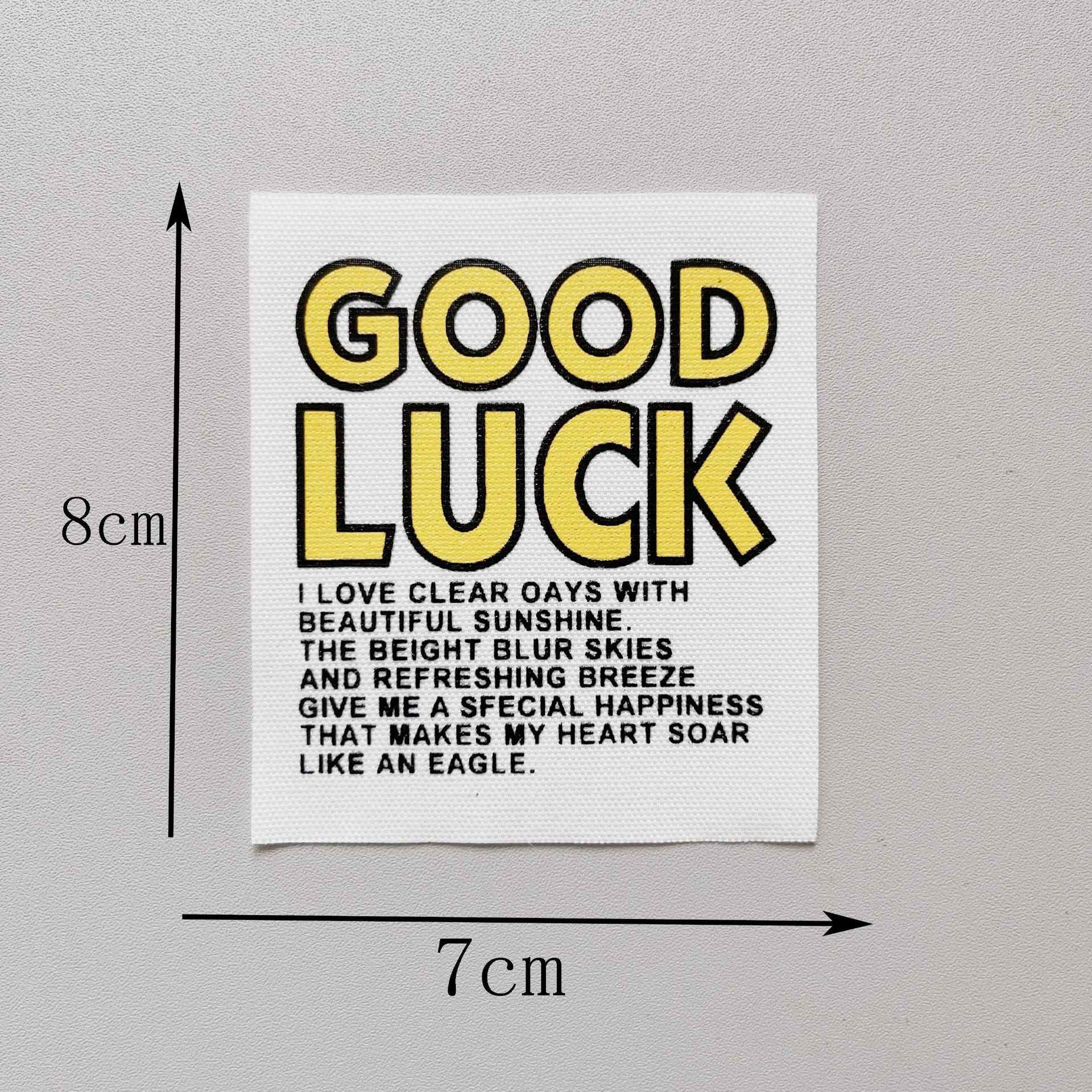“GOOD LUCK” fabric patch, yellow letters with dark outline, 8x7cm