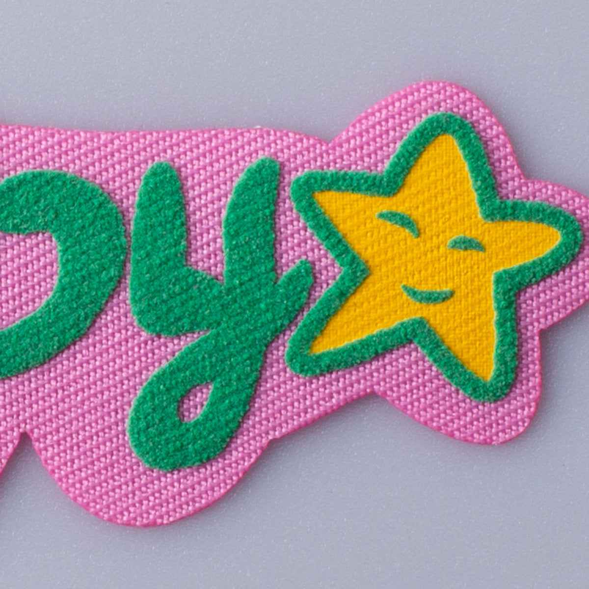 Luck 3D fabric patch with green letters and yellow star on pink
