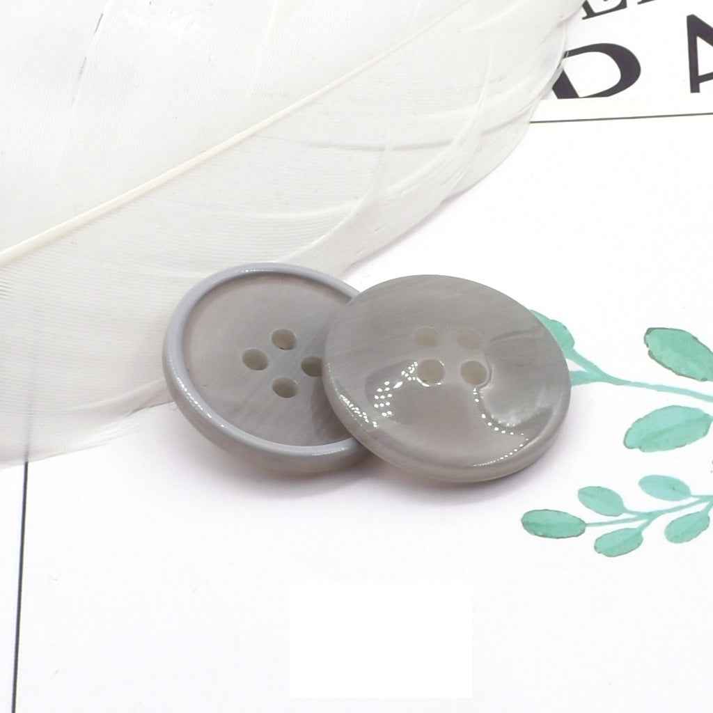 Round 4-hole light gray resin coat buttons with pearl-look edge detail