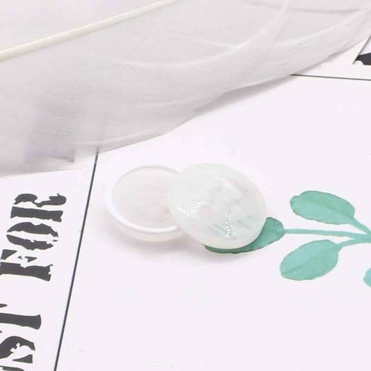 Round 4-hole white/ivory resin coat buttons with pearl-look edge detail