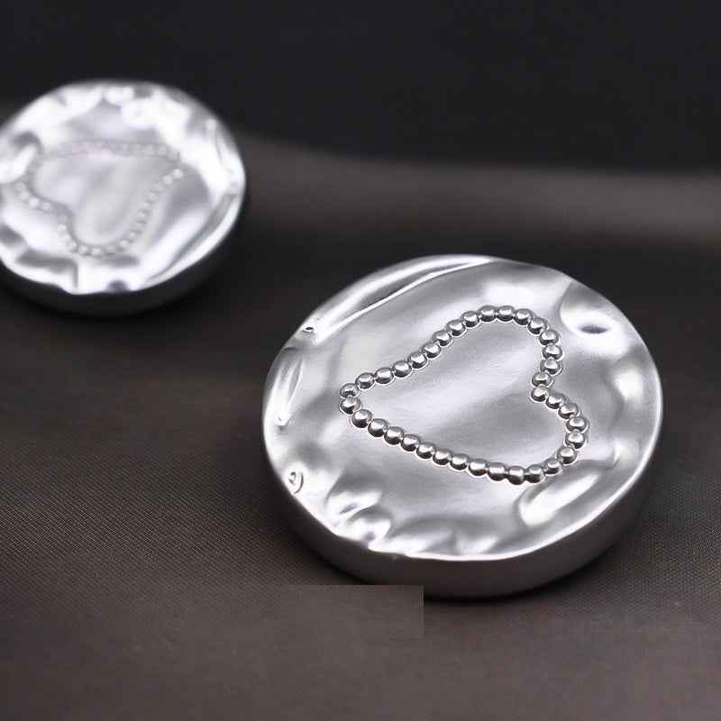 Silver heart metal shank button, dotted heart outline design on shiny face