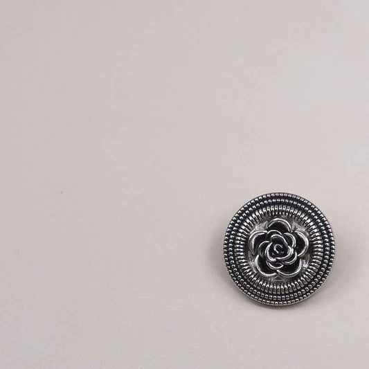 Nickel-black hollow rose metal button, circular beaded rim and raised flower petals